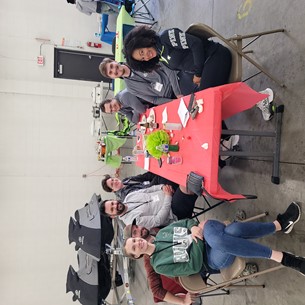 people sitting around an orange table